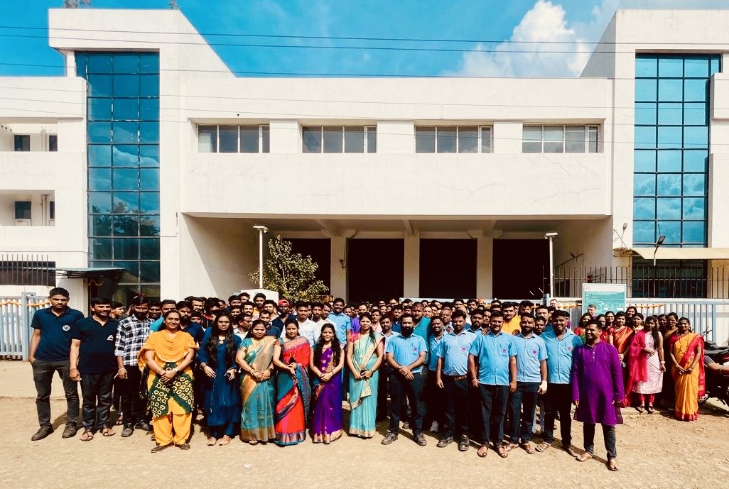 AQ India team welcoming visitors outside the facility
